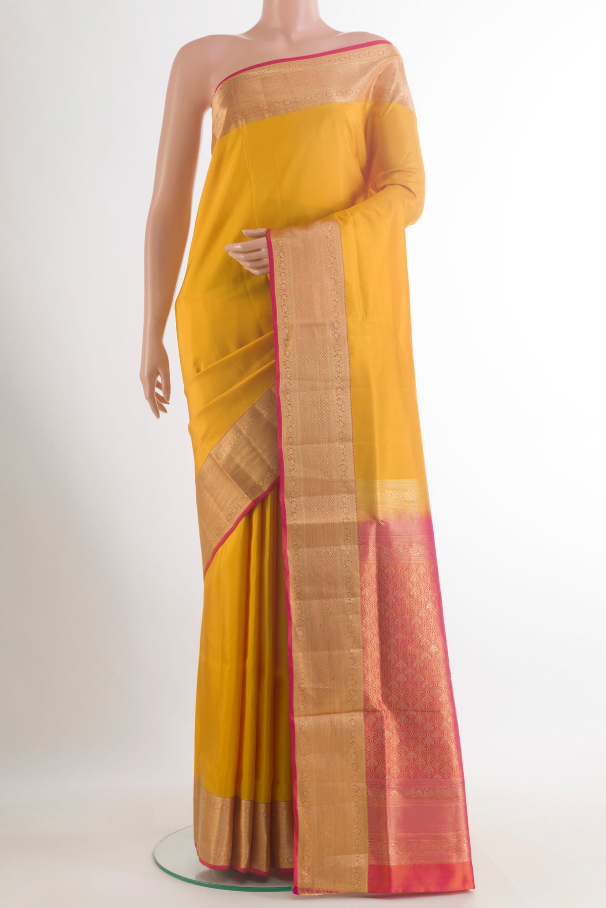 Pure Silk Yellow Soft Saree with Plain Body and Zari Border.  displayed on a mannequin
