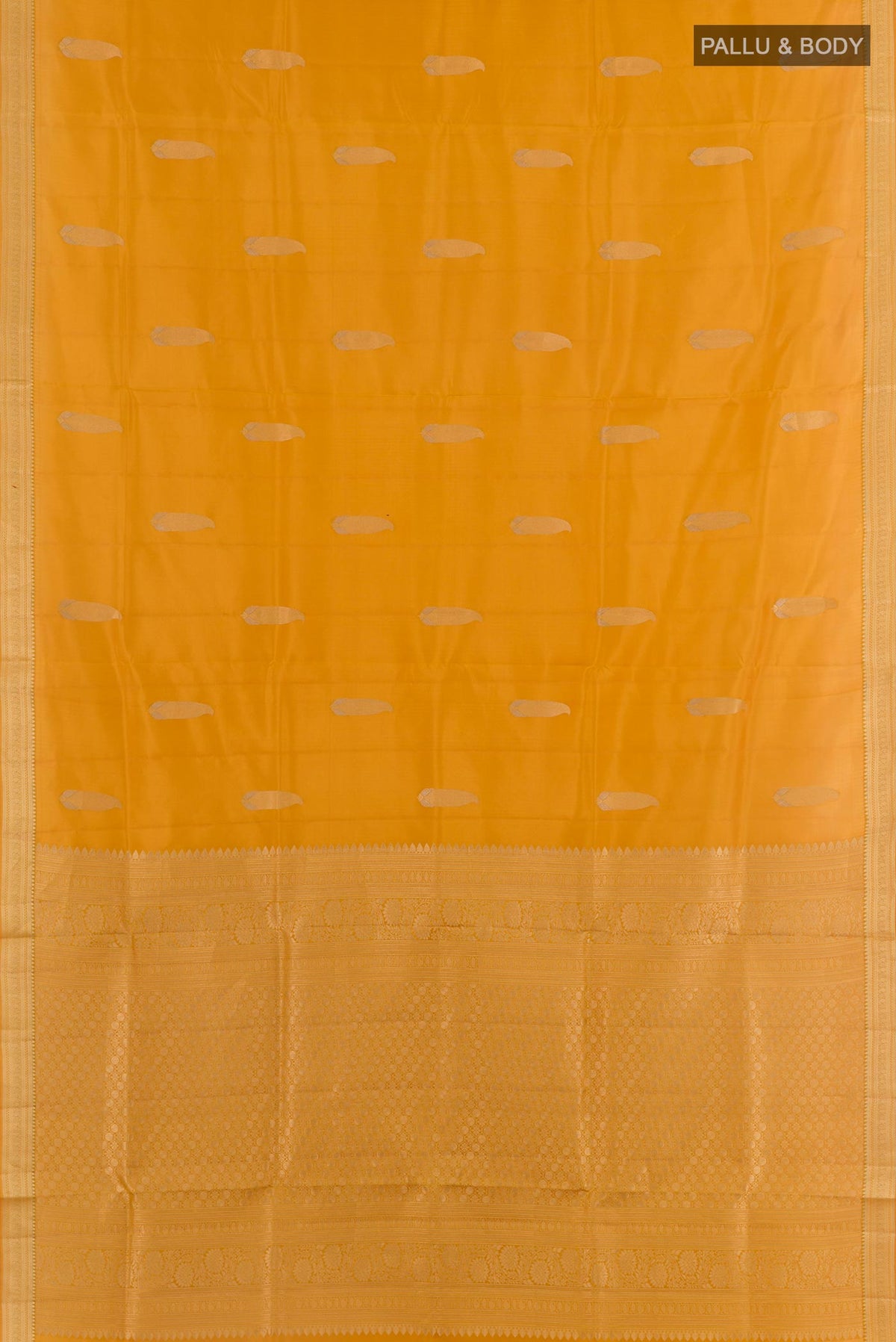 Flat view of Mustard Soft Silk Saree with Zari Butta on the body and Zari Border. 