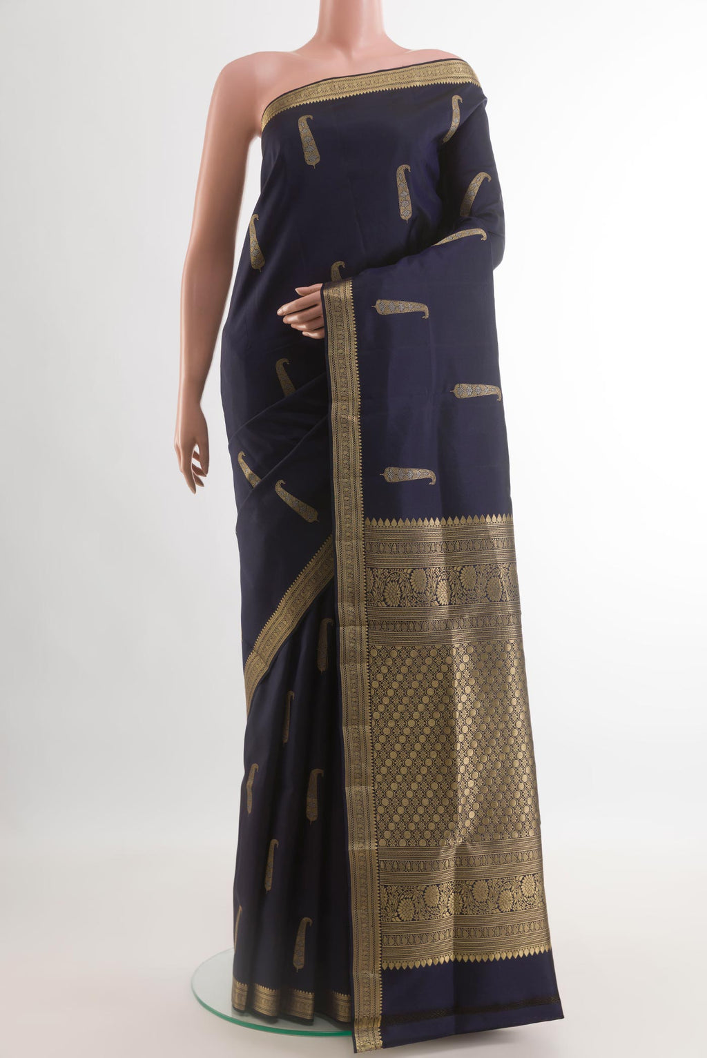 Navy Blue Soft Silk Saree with Zari Butta on the body and Zari Border.  displayed on a mannequin