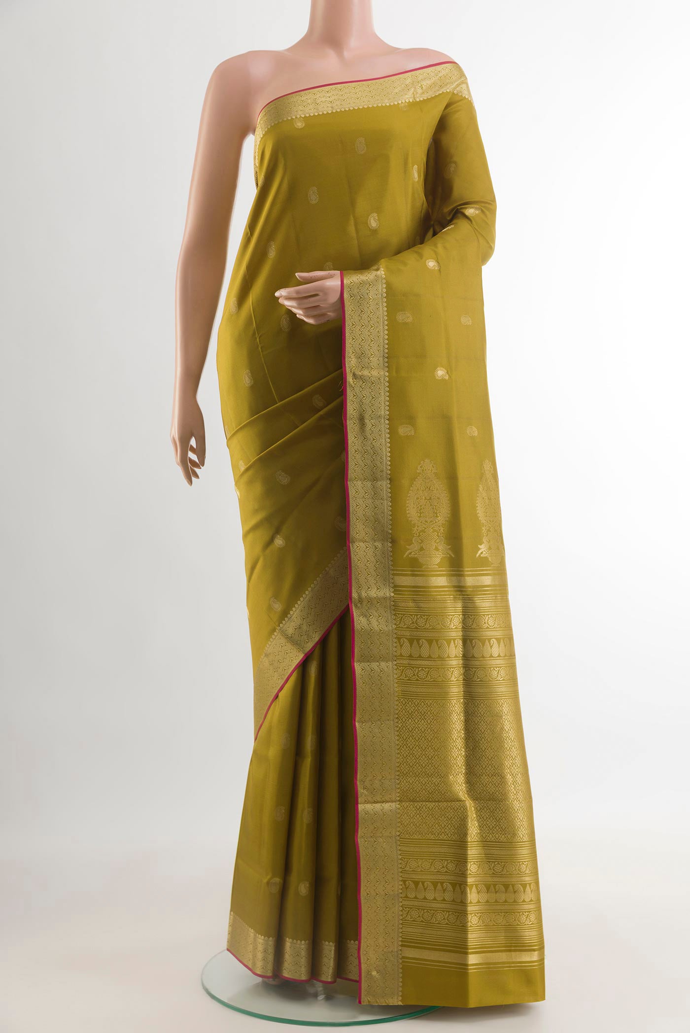 Mehandi Green Soft Silk Saree with Zari Butta on the body and Zari Border.  displayed on a mannequin