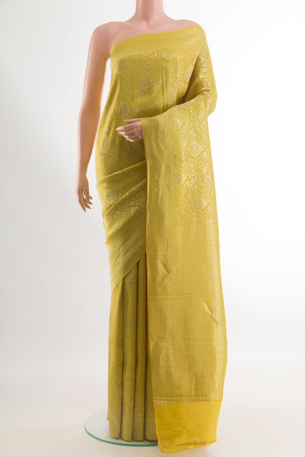 Yellow Mysore Crepe Saree with Zari Brocade on the body and Zari Border.  displayed on a mannequin