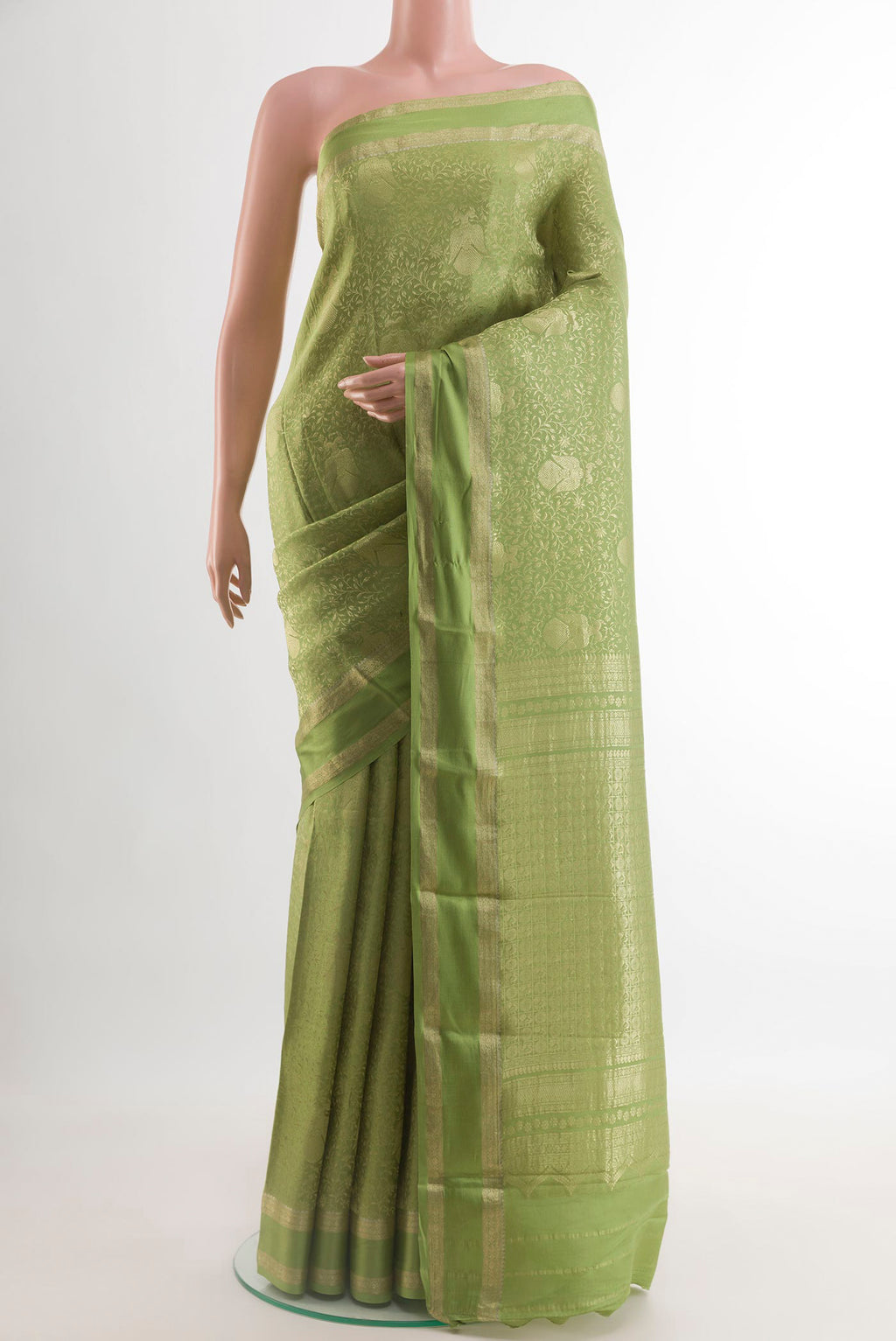 Green Mysore Crepe Saree with Zari Brocade on the body and Zari Border.  displayed on a mannequin