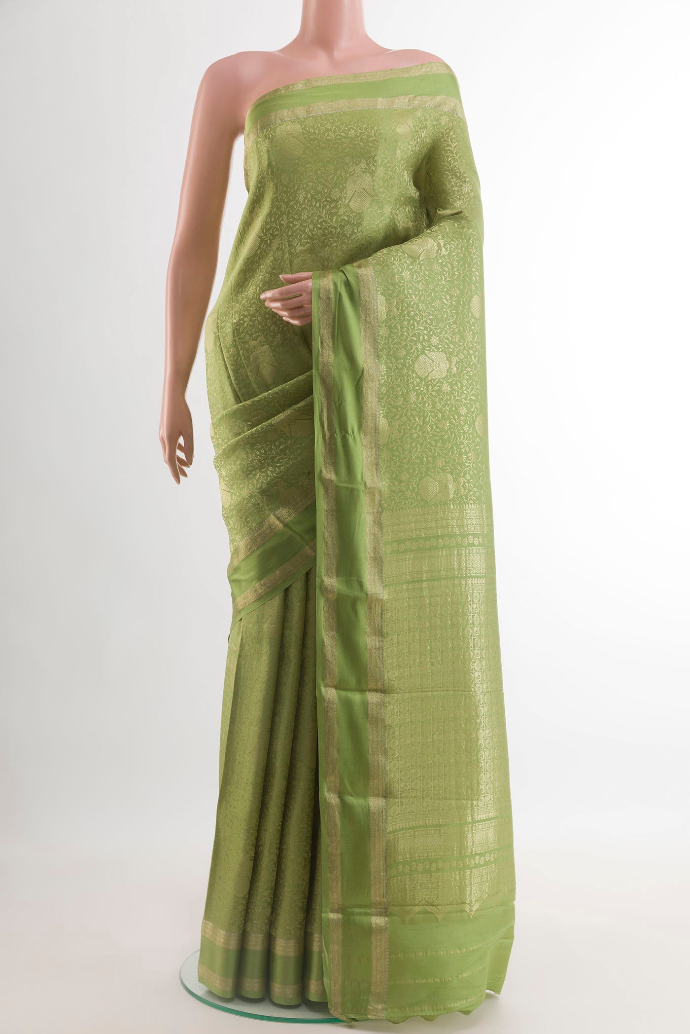 Green Mysore Crepe Saree with Zari Brocade on the body and Zari Border.  displayed on a mannequin