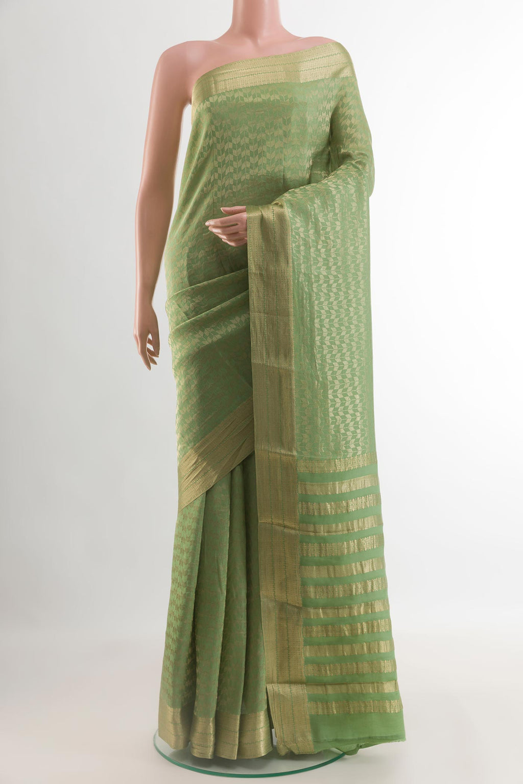 Sage Green Mysore Crepe Saree with Zari Brocade on the body and Zari Border.  displayed on a mannequin