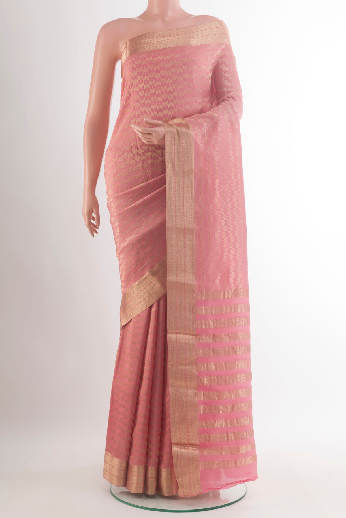 Peach Mysore Crepe Saree with Zari Brocade on the body and Zari Border.  displayed on a mannequin