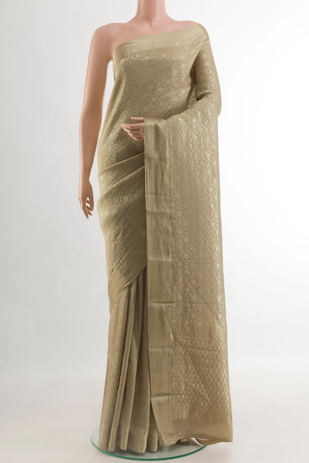 Beige Mysore Crepe Saree with Zari Brocade on the body and Zari Border.  displayed on a mannequin