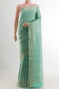 Light Blue Mysore Crepe Saree with Zari Brocade on the body and Zari Border.  displayed on a mannequin