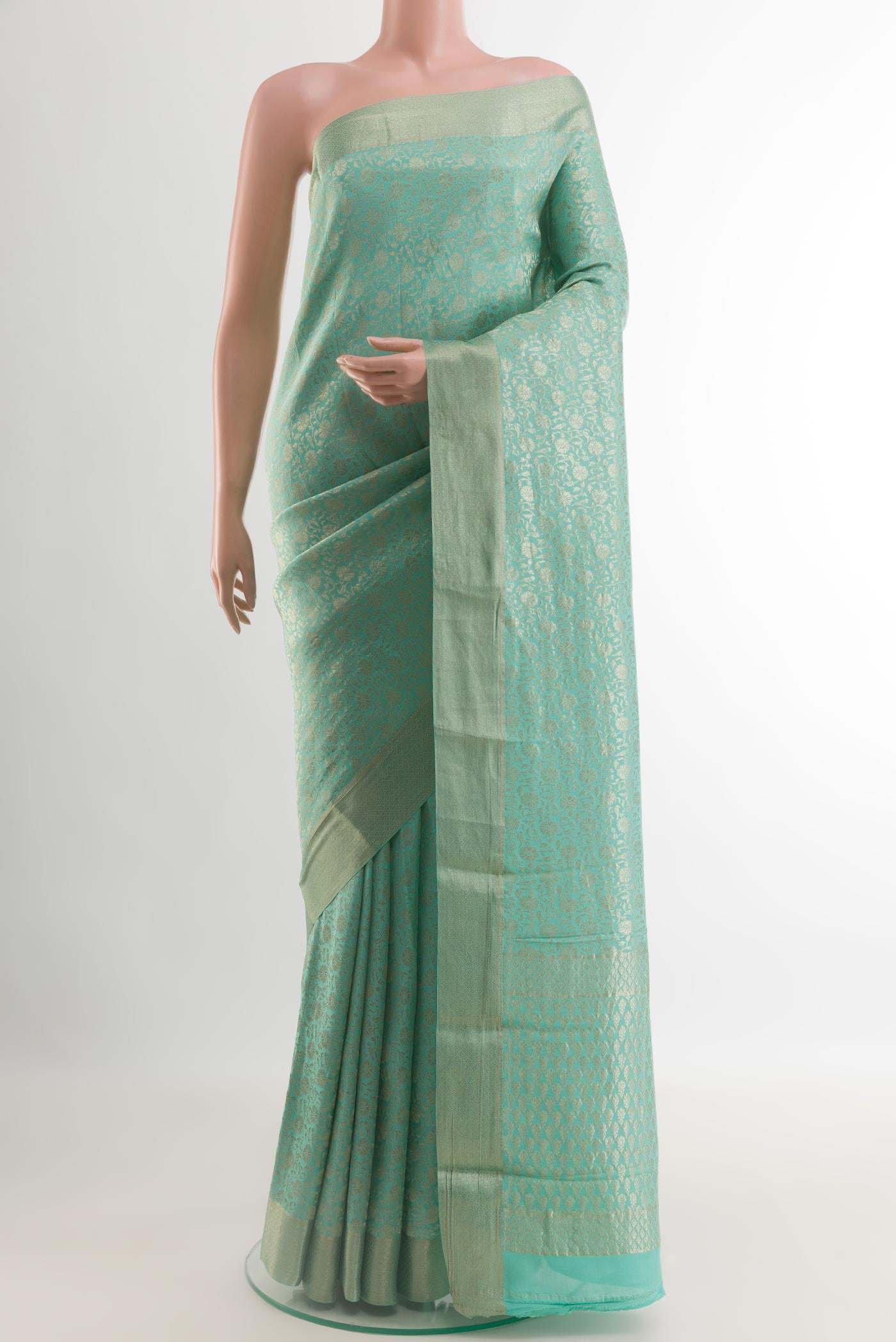 Light Blue Mysore Crepe Saree with Zari Brocade on the body and Zari Border.  displayed on a mannequin