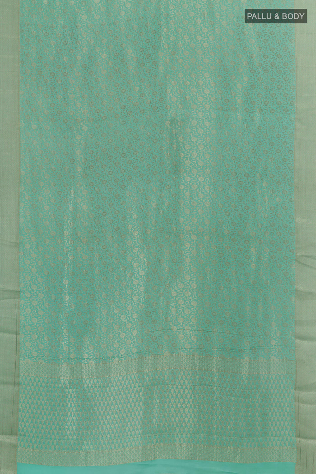 Flat view of Light Blue Mysore Crepe Saree with Zari Brocade on the body and Zari Border. 