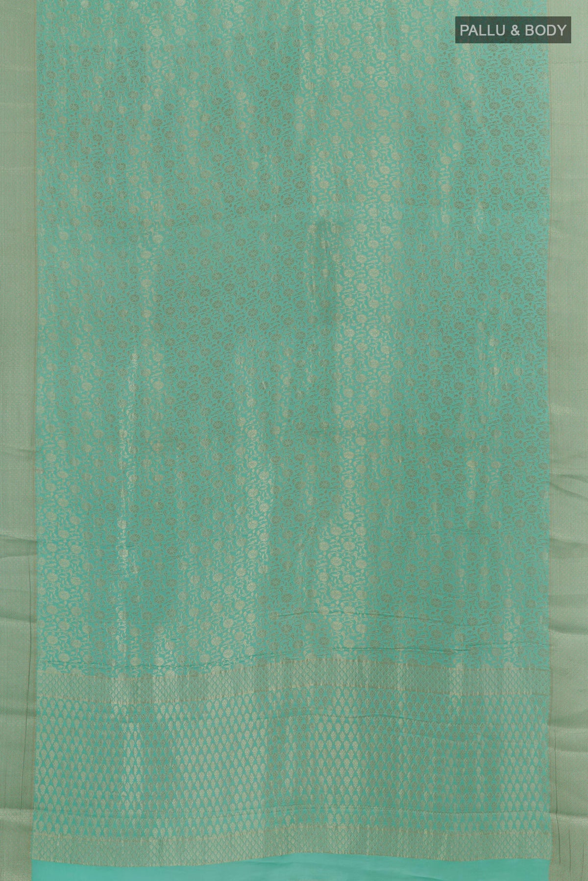 Flat view of Light Blue Mysore Crepe Saree with Zari Brocade on the body and Zari Border. 