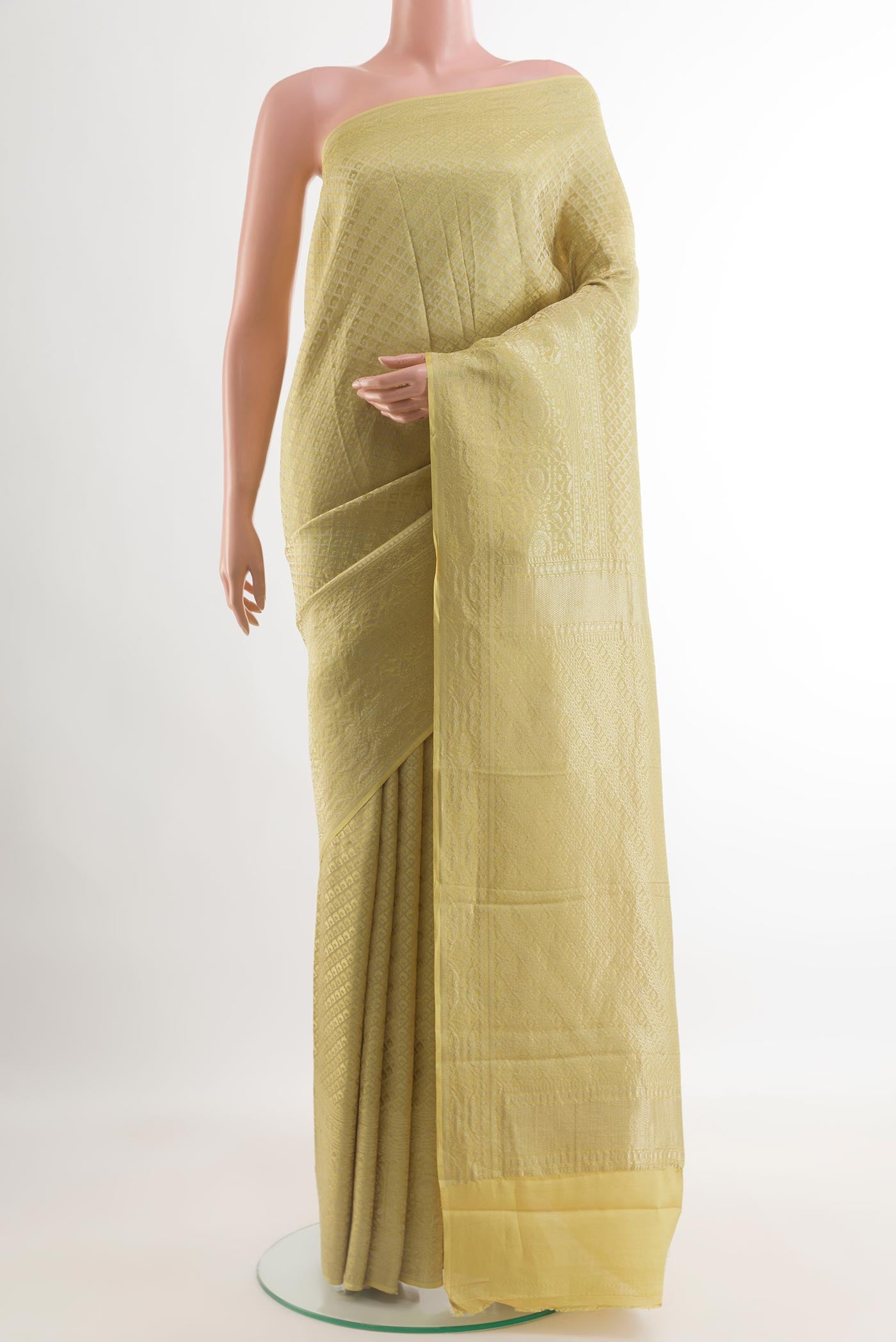 Sandal Mysore Crepe Saree with Zari Butta on the body and Zari Border.  displayed on a mannequin