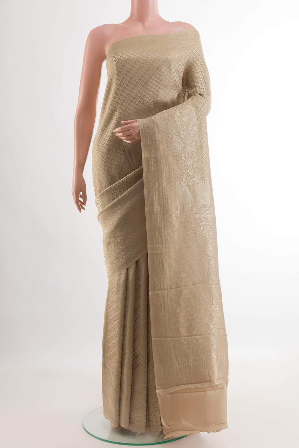Beige Mysore Crepe Saree with Zari Brocade on the body and Zari Border.  displayed on a mannequin