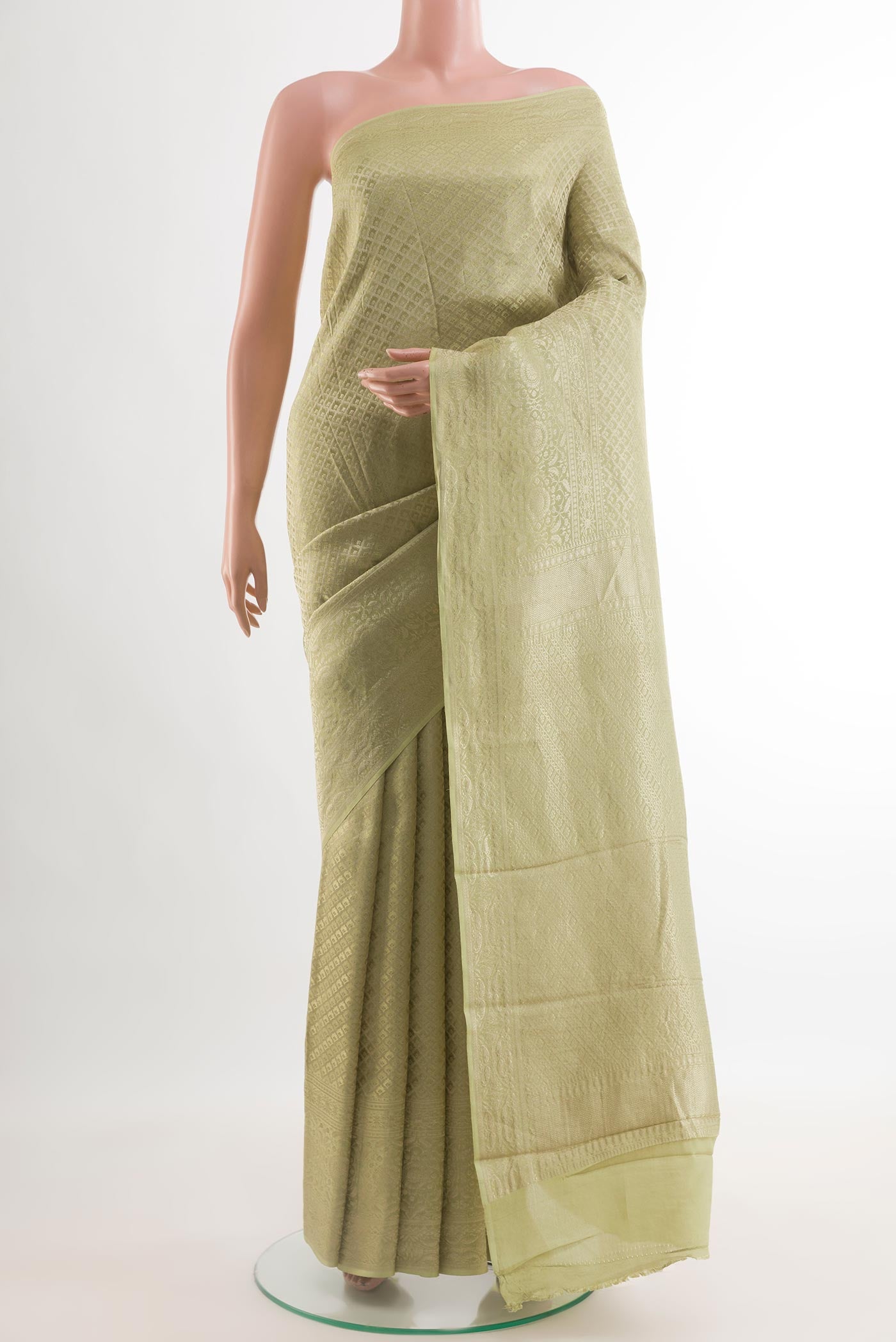 Green Mysore Crepe Saree with Zari Brocade on the body and Zari Border.  displayed on a mannequin