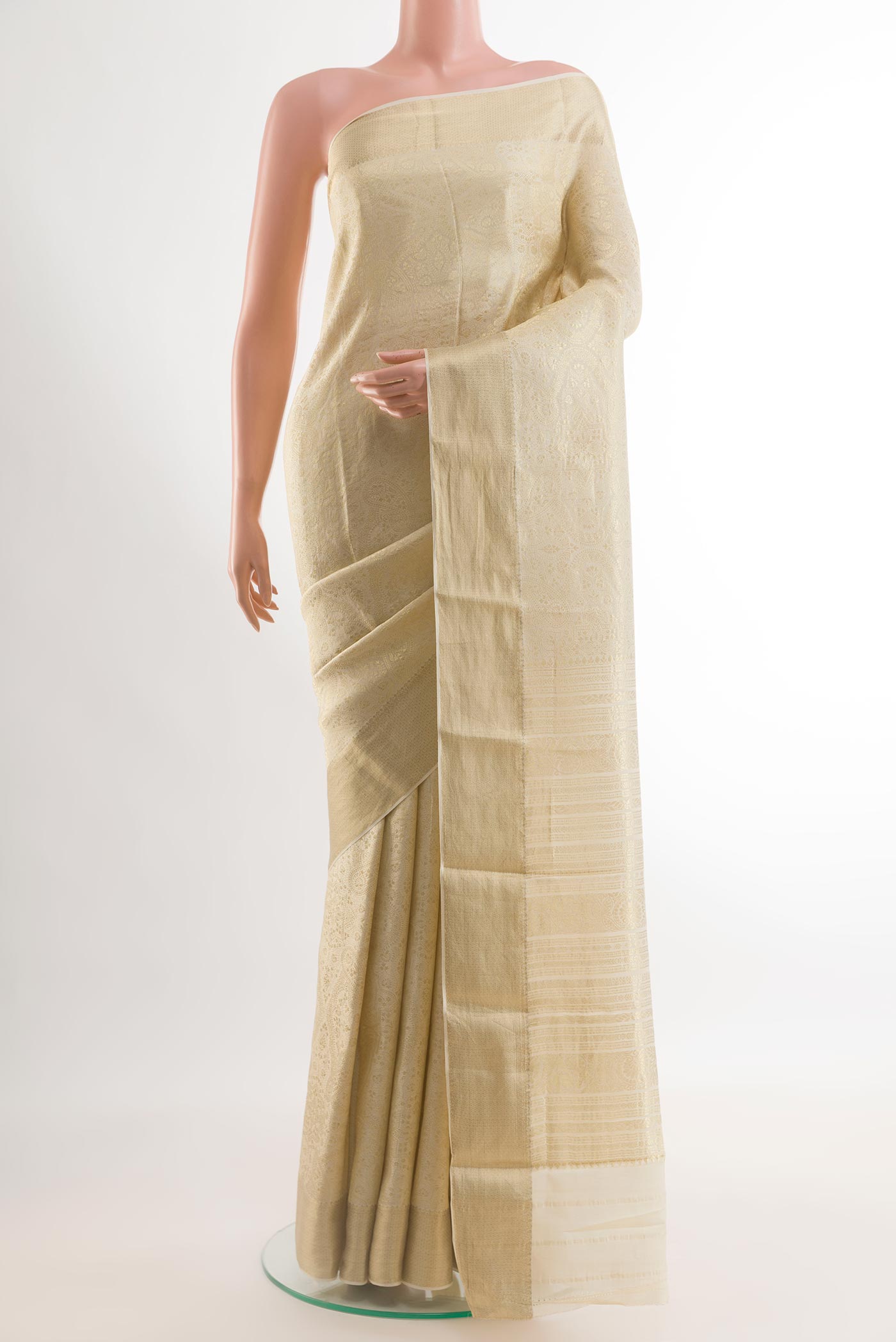 Off White Mysore Crepe Saree with Zari Brocade on the body and Zari Border.  displayed on a mannequin
