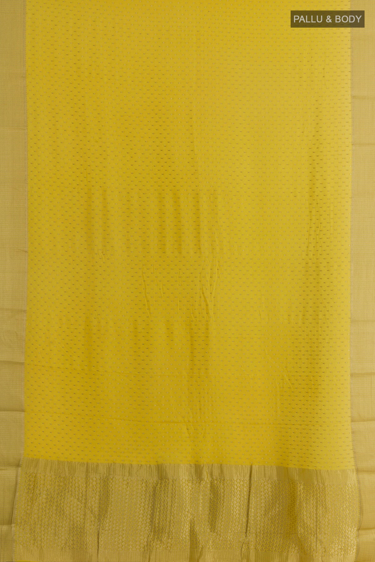 Flat view of Yellow Mysore Crepe Saree with Zari Butta on the body and Zari Border. 