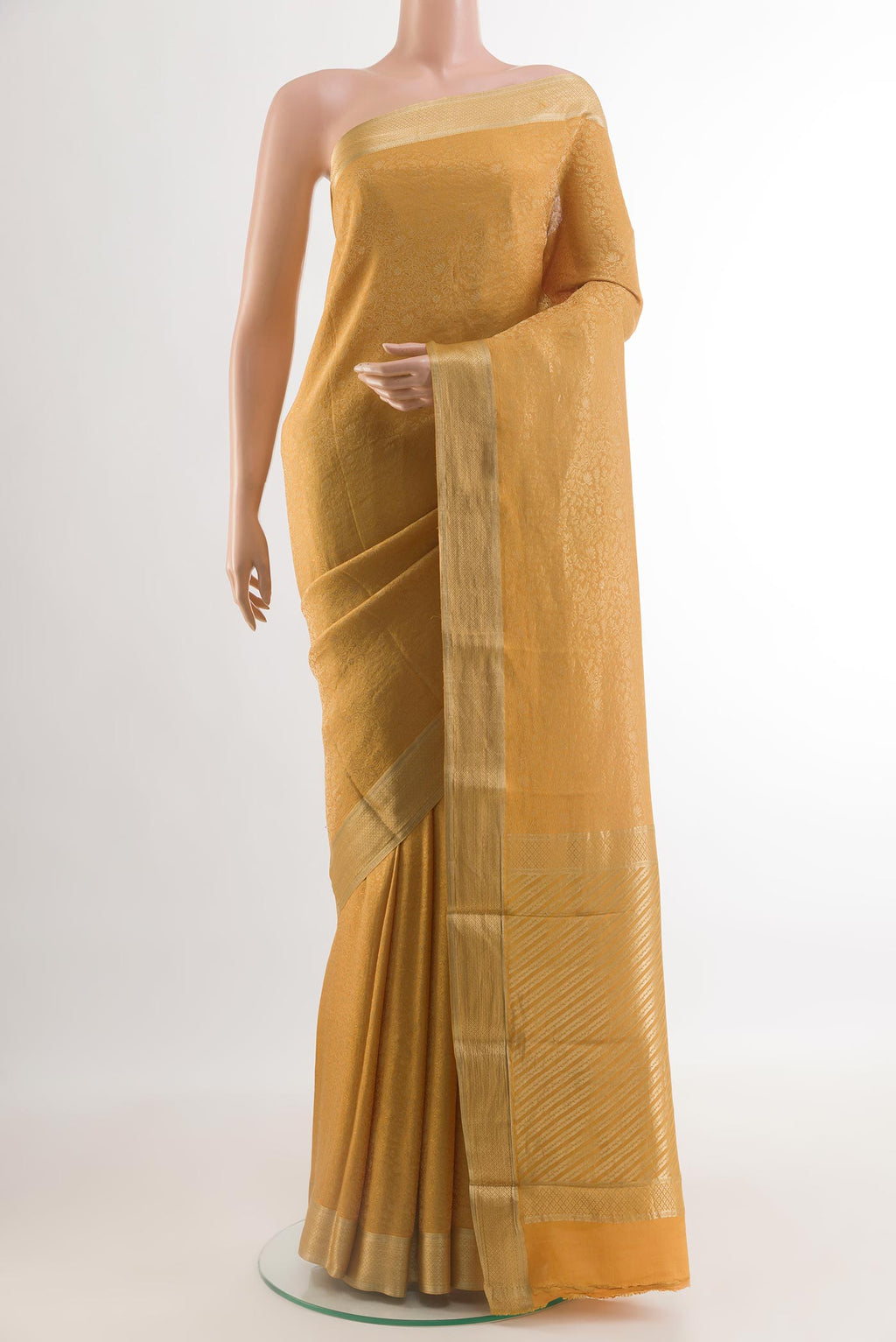 Mustard Mysore Crepe Saree with Zari Brocade on the body and Zari Border.  displayed on a mannequin