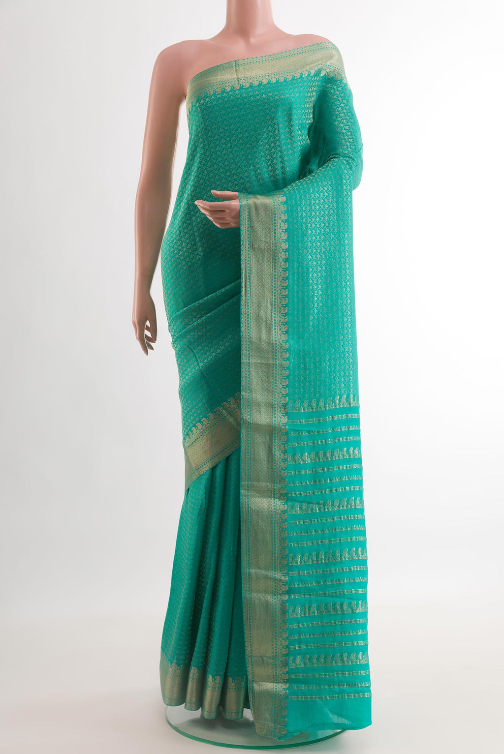 Turquoise Mysore Crepe Saree with Zari Brocade on the body and Zari Border.  displayed on a mannequin