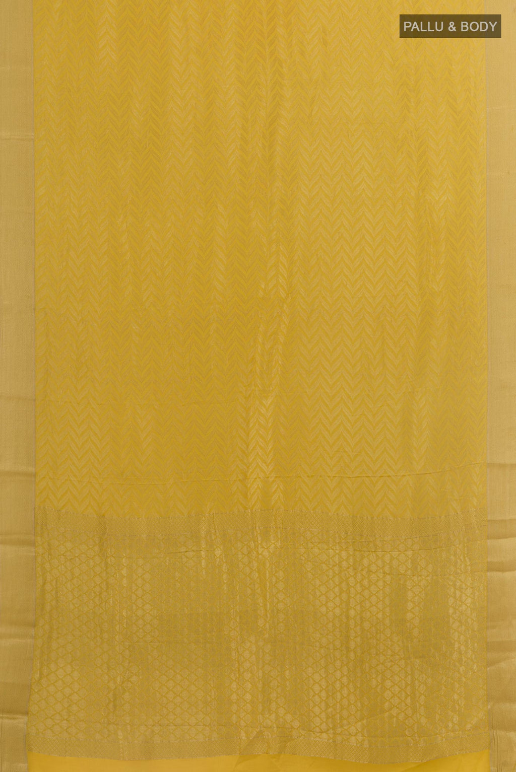 Flat view of Yellow Mysore Crepe Saree with Zari Brocade on the body and Zari Border. 