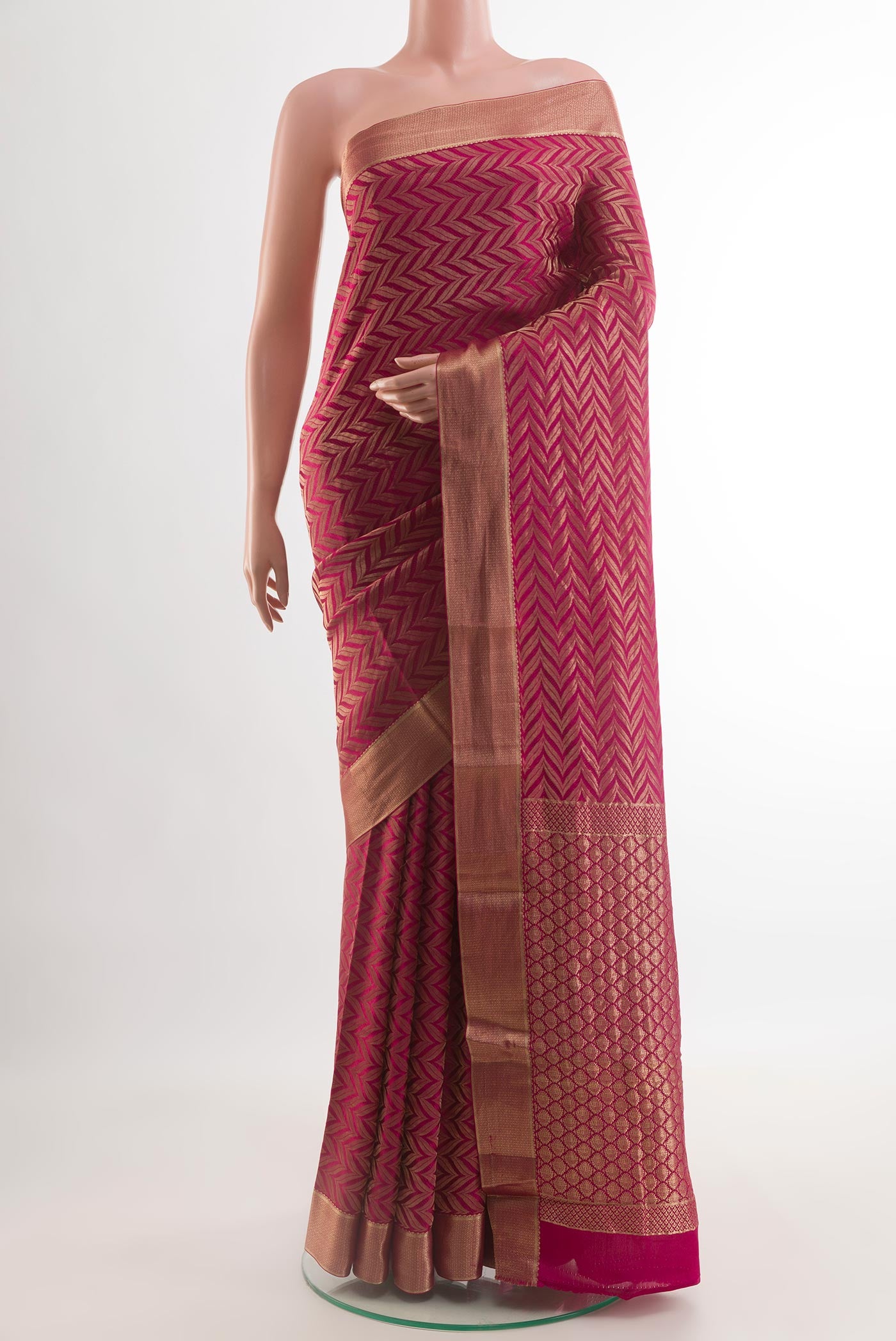 Dark Pink Mysore Crepe Saree with Zari Brocade on the body and Zari Border.  displayed on a mannequin