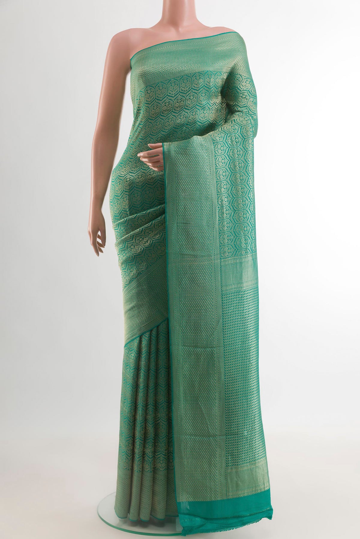 Sea Green Mysore Crepe Saree with Zari Brocade on the body and Zari Border.  displayed on a mannequin