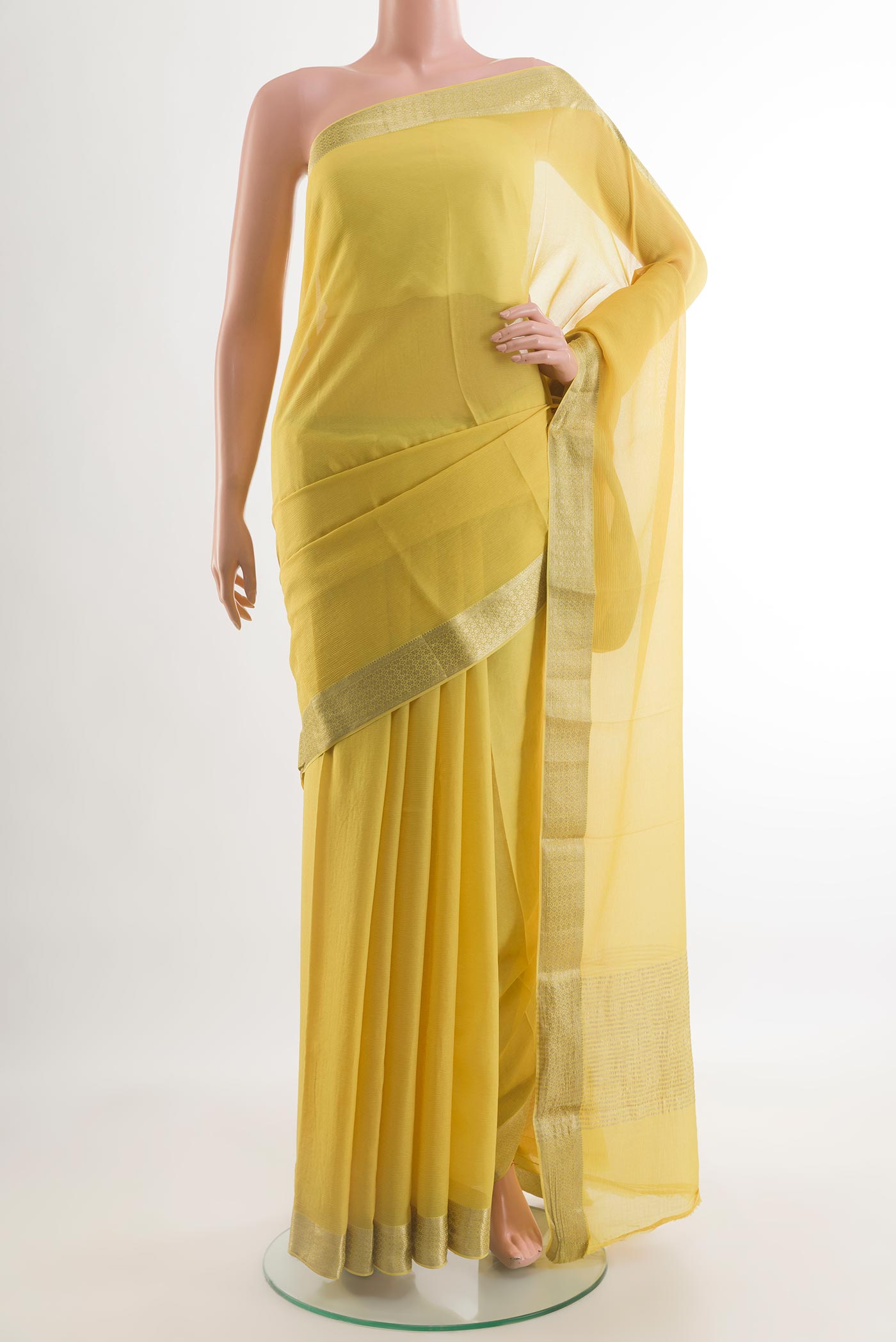 Yellow Mysore Chiffon Saree with Plain Body and Zari Border.  displayed on a mannequin