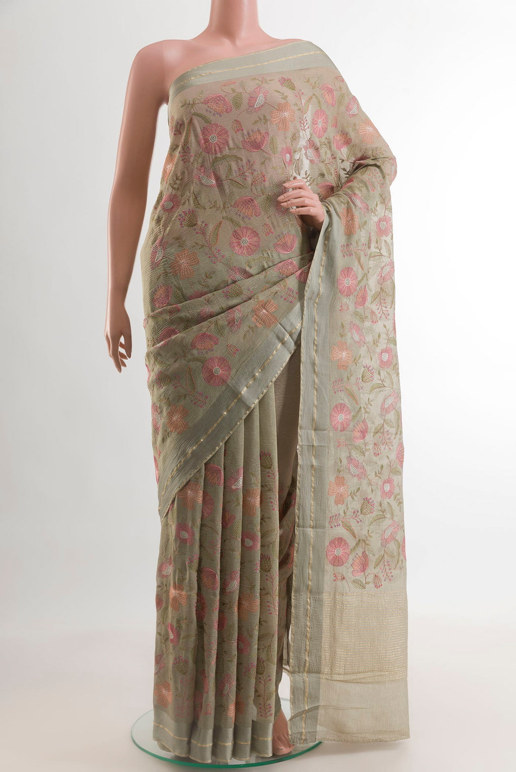 Grey Mysore Georgette Saree with Embroidery on the body and Zari Border.  displayed on a mannequin