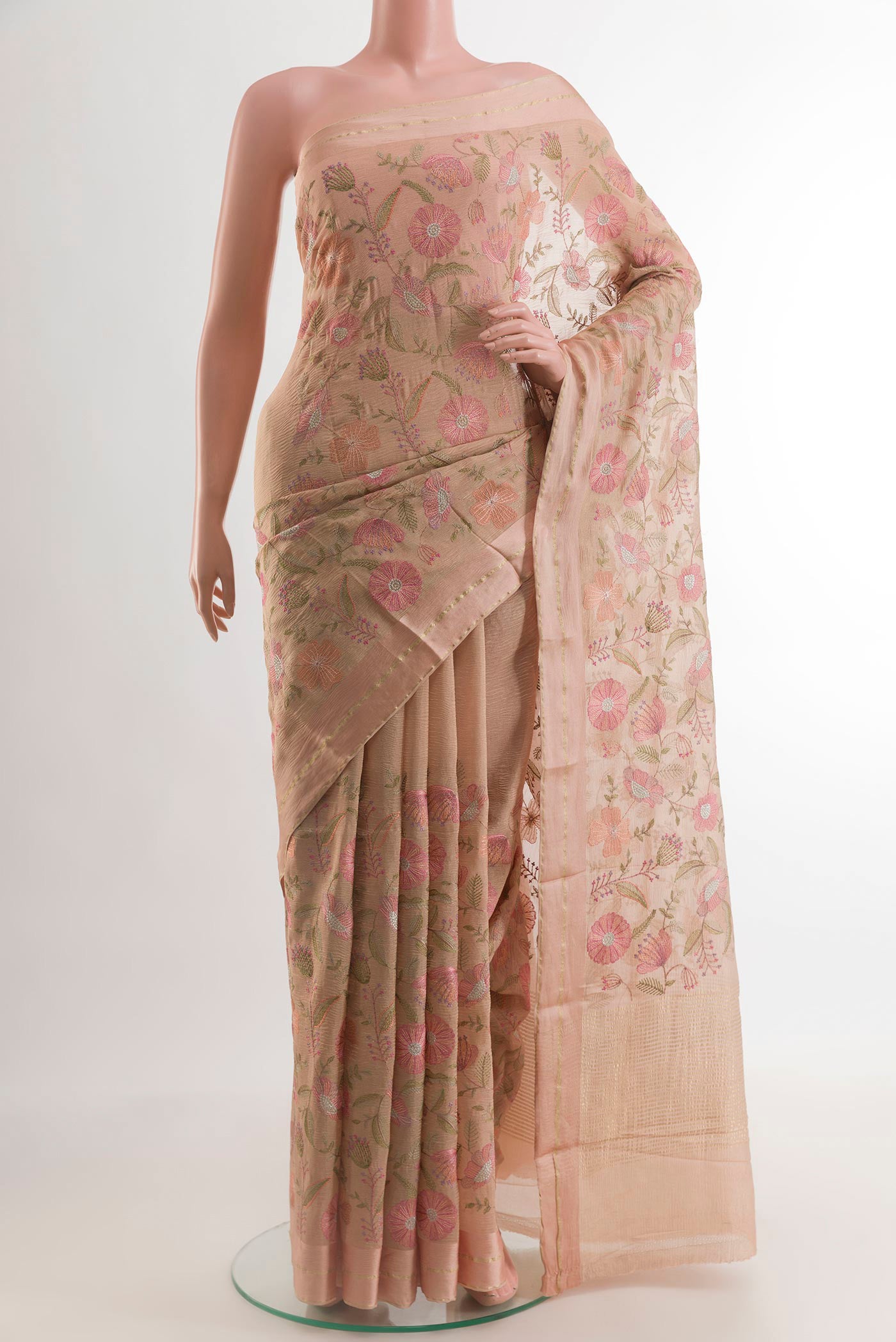 Rose Gold Mysore Georgette Saree with Embroidery on the body and Zari Border.  displayed on a mannequin