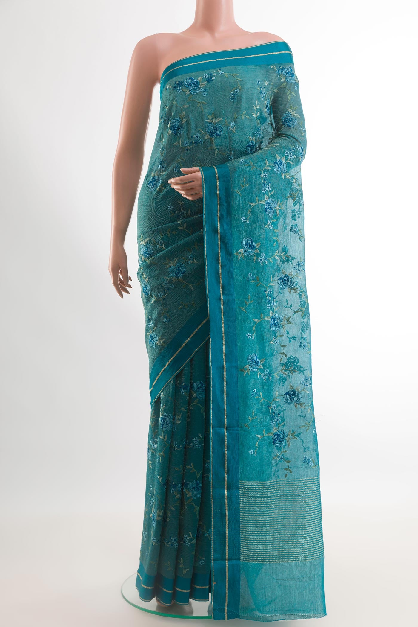 Blue Mysore Georgette Saree with Embroidery on the body and Zari Border.  displayed on a mannequin