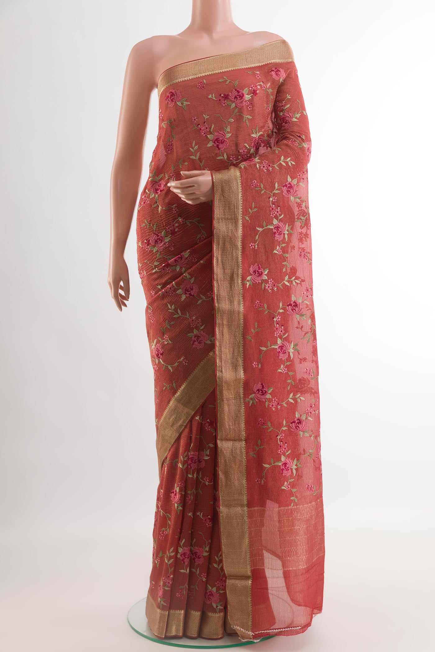 Coral Mysore Georgette Saree with Embroidery on the body and Zari Border.  displayed on a mannequin
