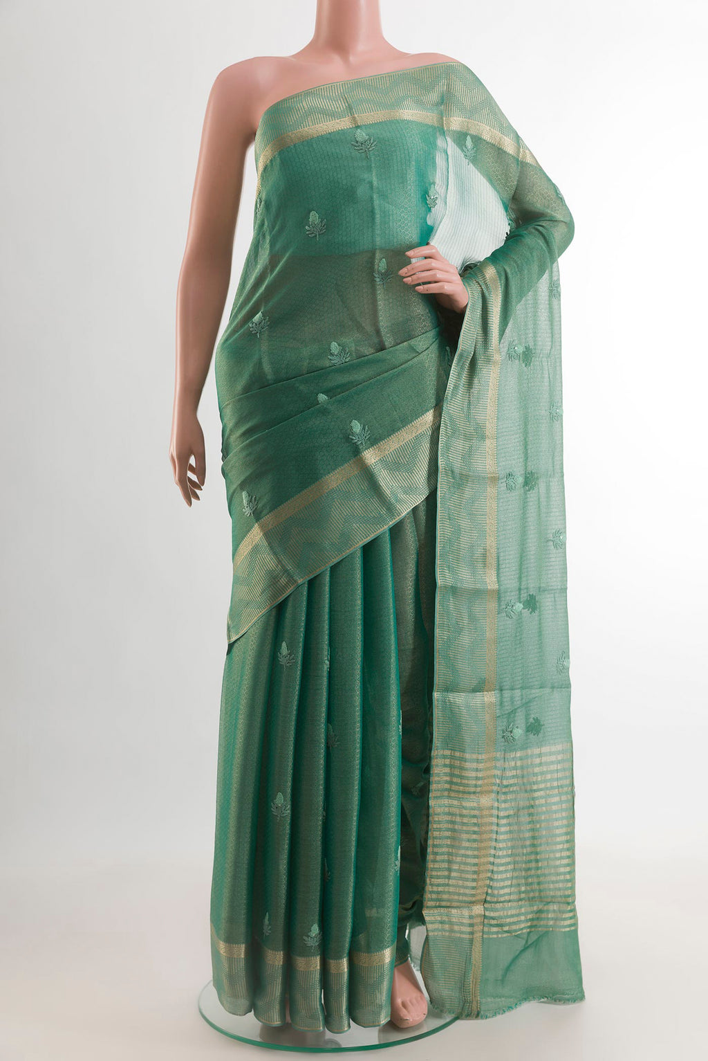 Sea Green Mysore Georgette Saree with Embroidery on the body and Zari Border.  displayed on a mannequin