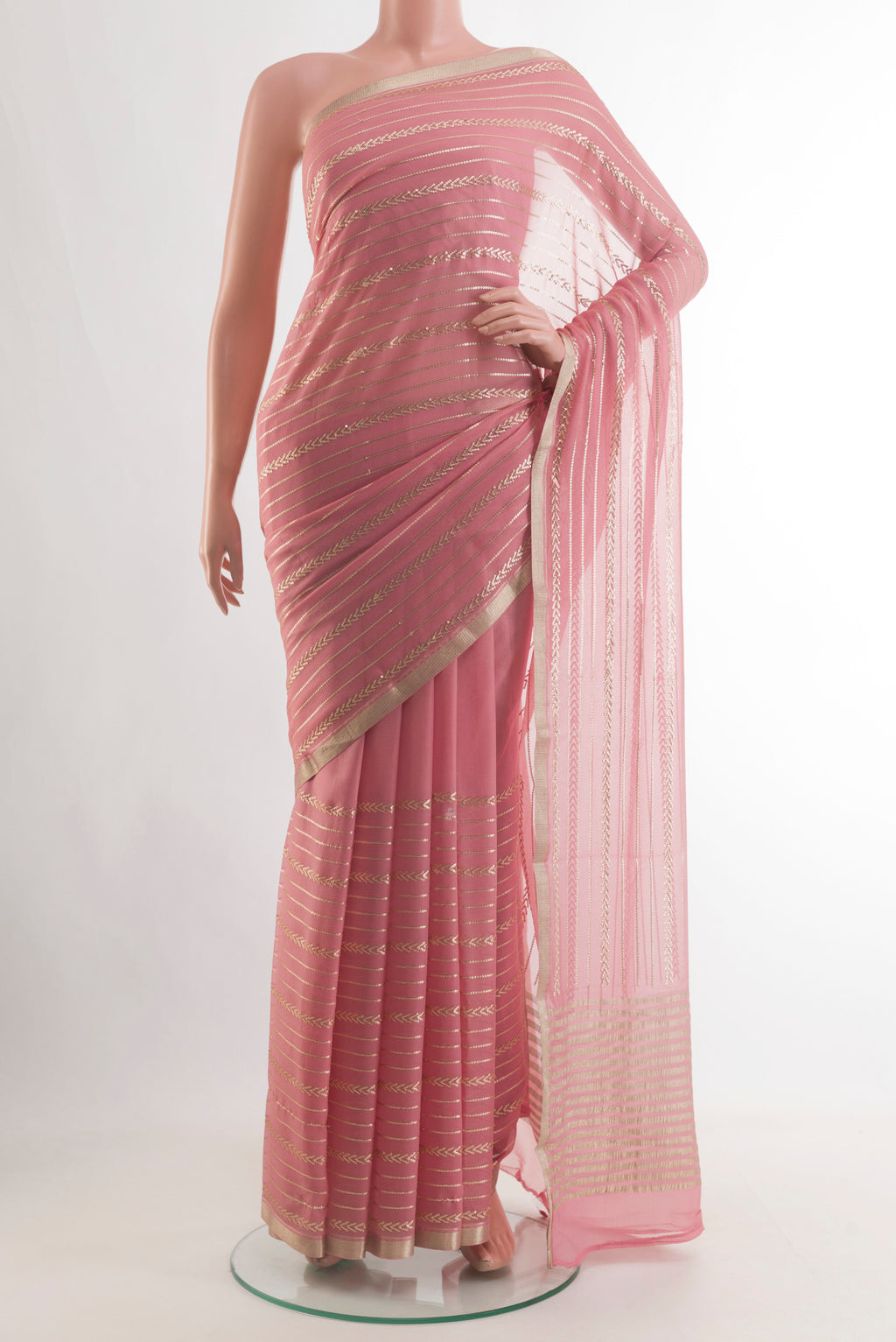 Pink Mysore Chiffon Saree with Stripes on the body and Zari Border.  displayed on a mannequin