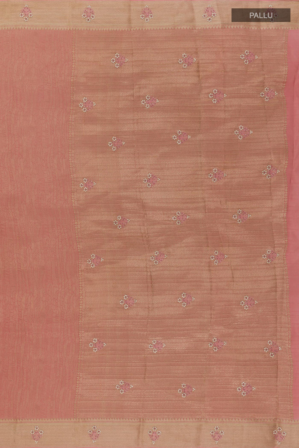 Close up image of the pallu of Rose Gold Mysore Crepe Saree with Zari Brocade on the body and Zari Border. 