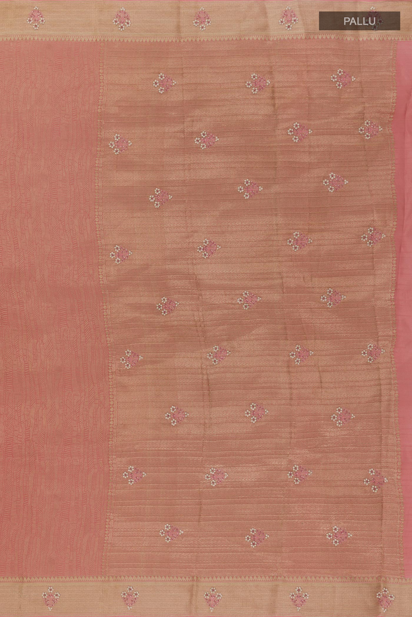 Close up image of the pallu of Rose Gold Mysore Crepe Saree with Zari Brocade on the body and Zari Border. 