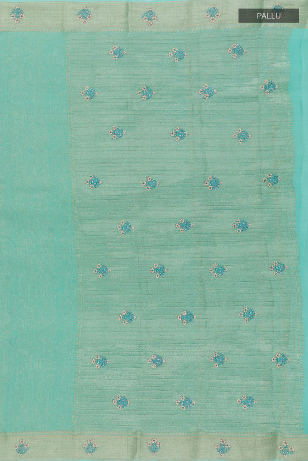 Close up image of the pallu of Turquoise Mysore Crepe Saree with Zari Brocade on the body and Zari Border. 