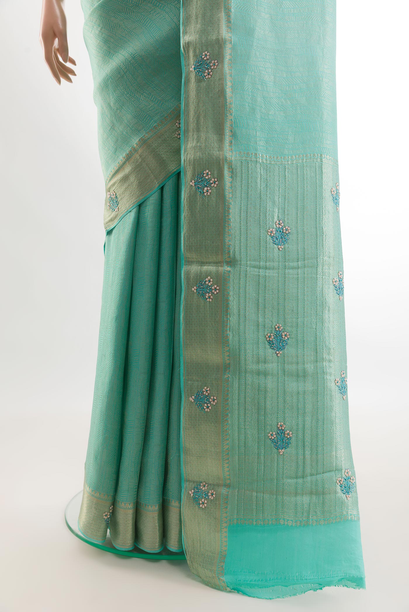 Pleats and pallu of Turquoise Mysore Crepe Saree with Zari Brocade on the body and Zari Border. 