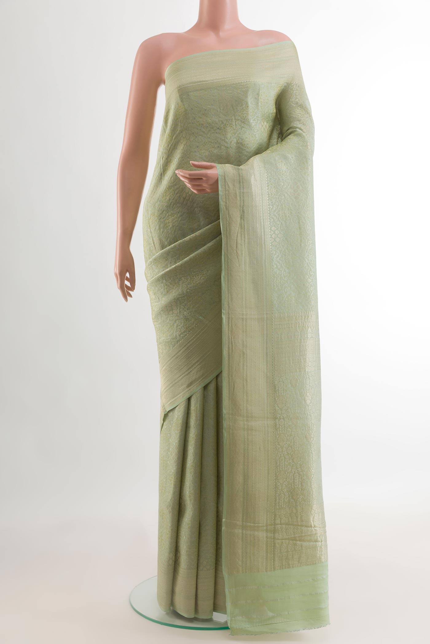 Mint Green Mysore Crepe Saree with Zari Brocade on the body and Zari Border.  displayed on a mannequin