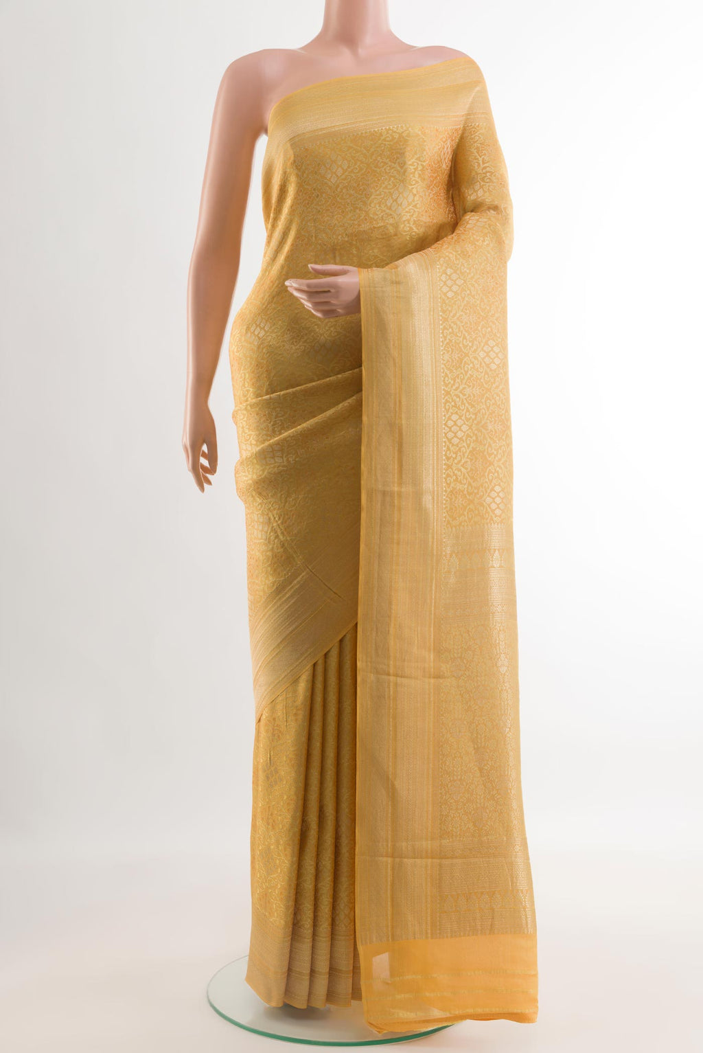 Yellow Mysore Crepe Saree with Zari Brocade on the body and Zari Border.  displayed on a mannequin