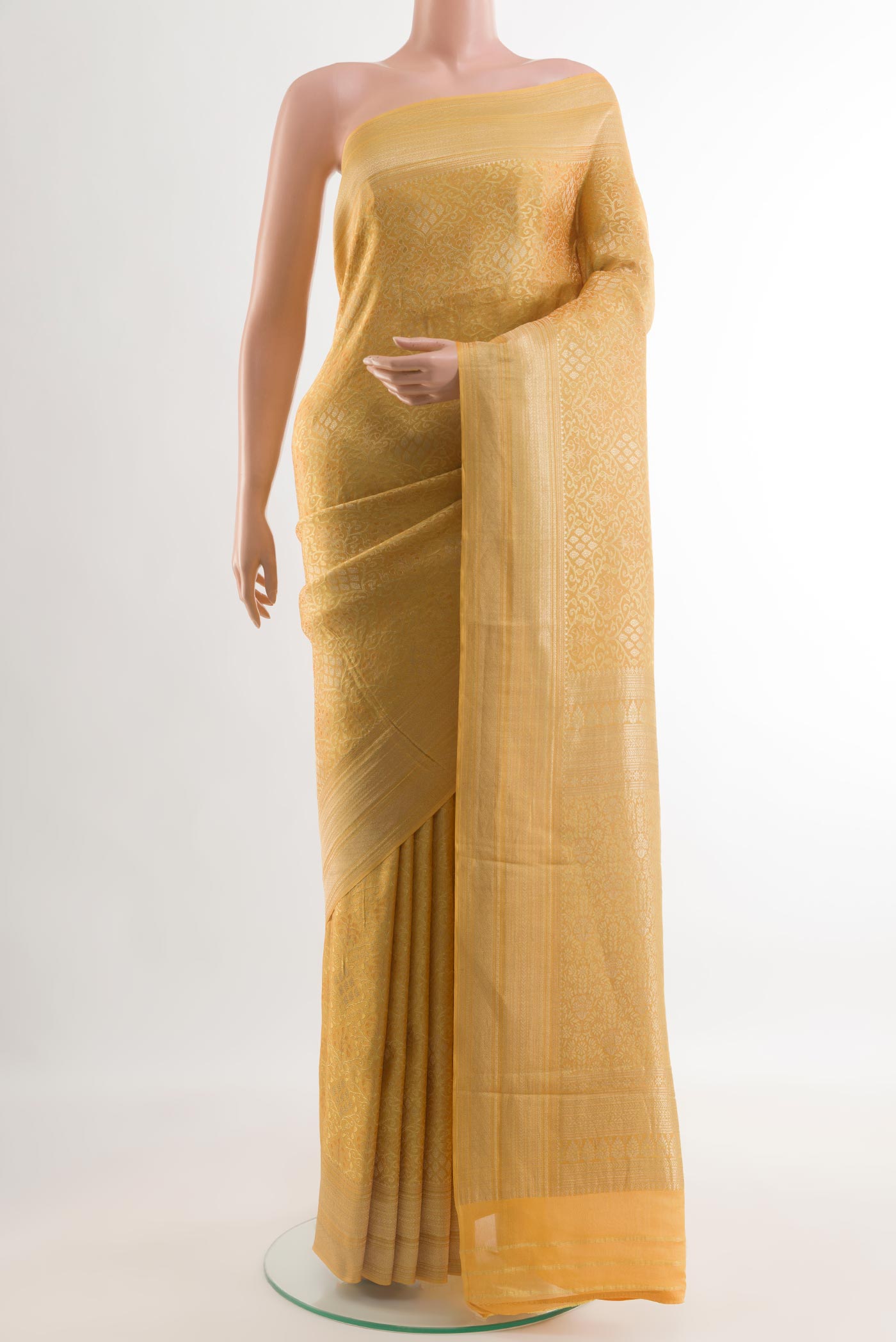 Yellow Mysore Crepe Saree with Zari Brocade on the body and Zari Border.  displayed on a mannequin