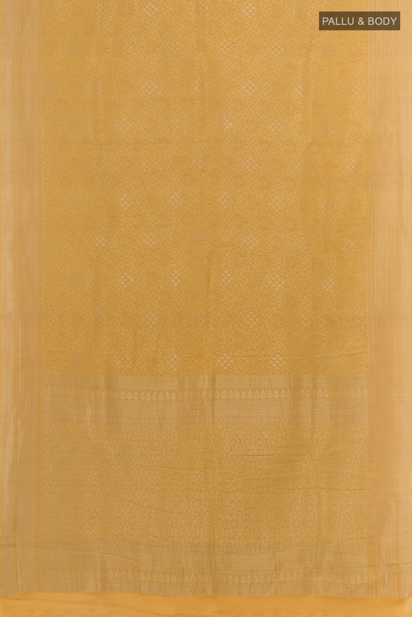 Flat view of Yellow Mysore Crepe Saree with Zari Brocade on the body and Zari Border. 