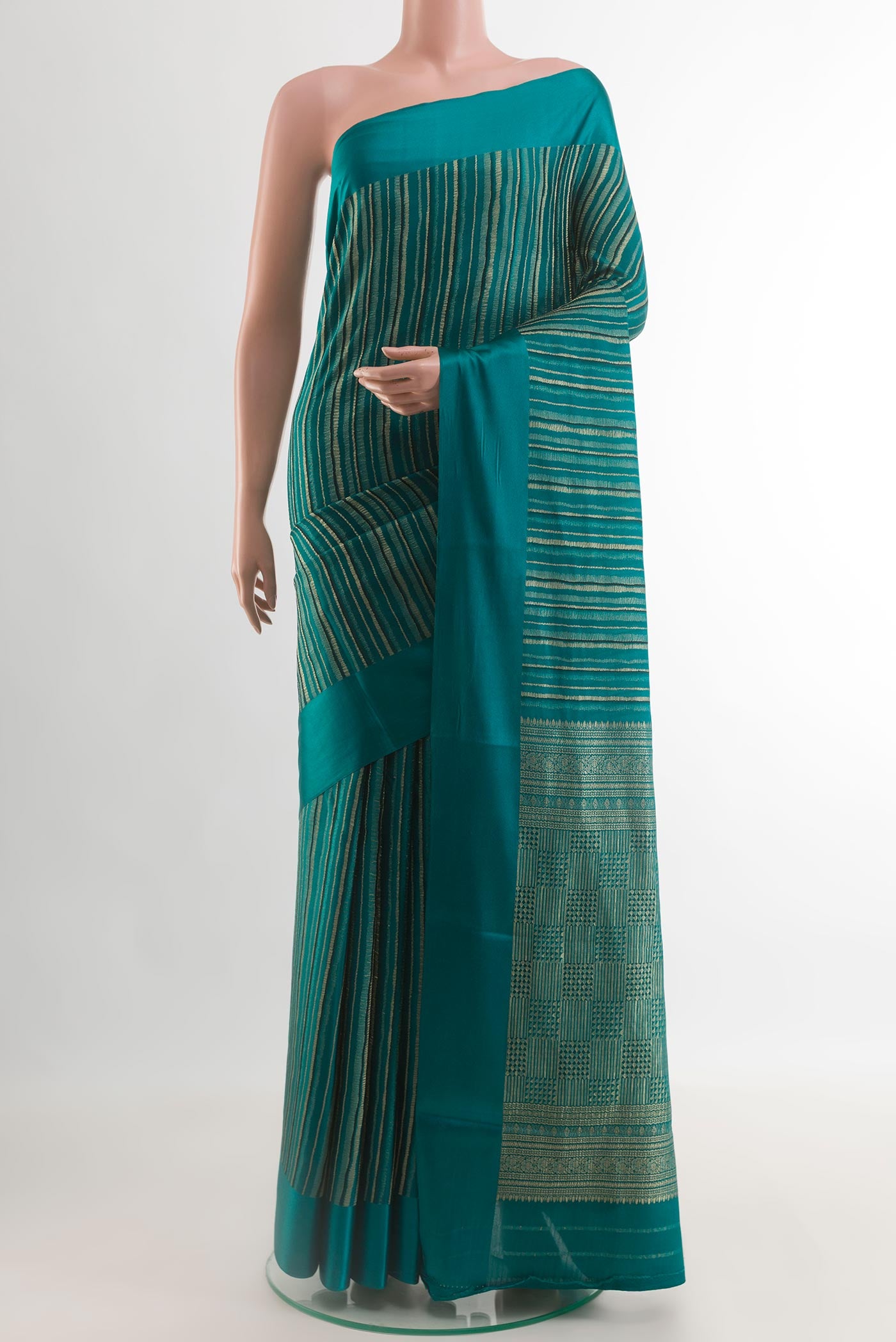 Teal Mysore Crepe Saree with Stripes on the body and Plain Border.  displayed on a mannequin