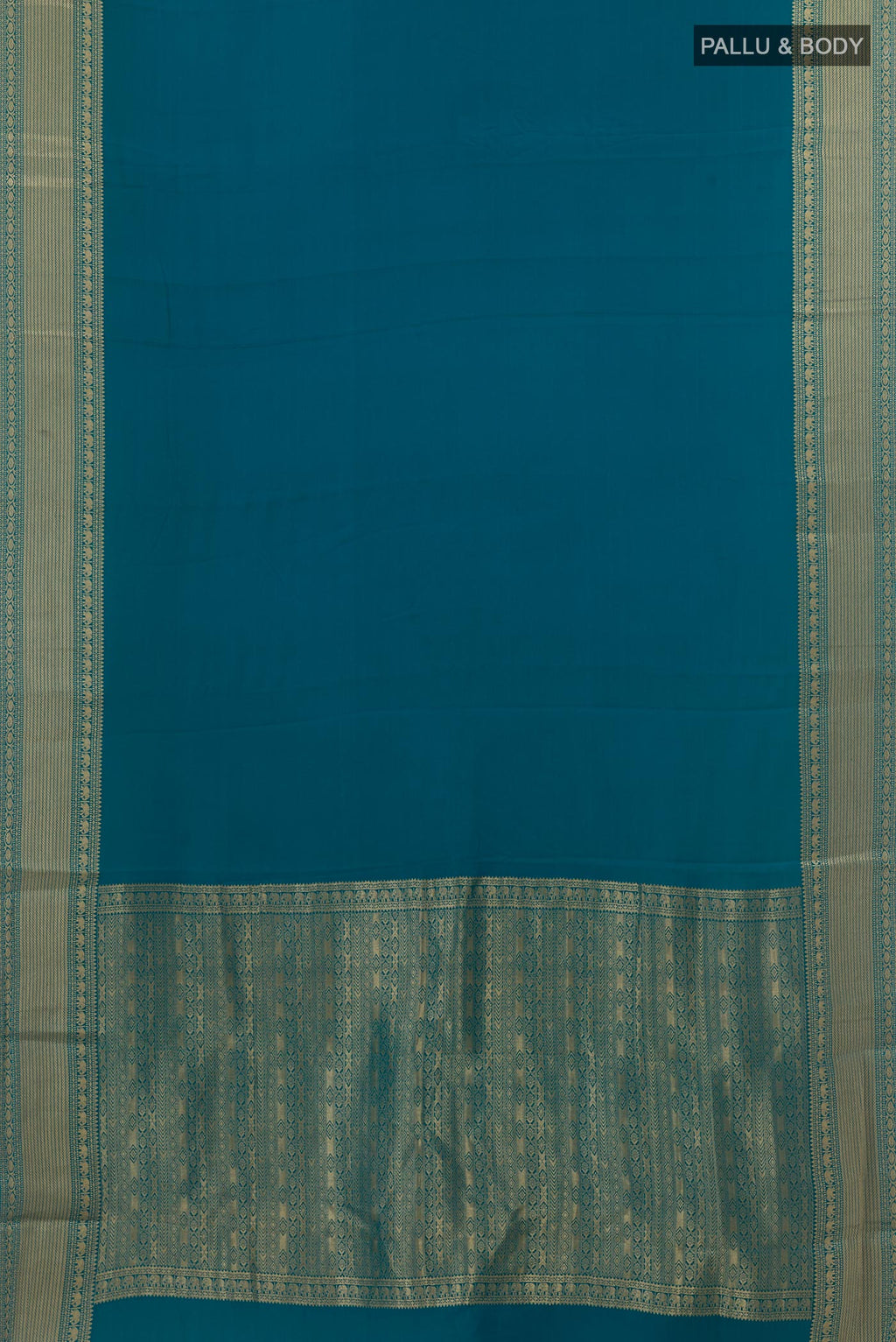 Flat view of Peacock Blue Mysore Crepe Saree with Plain Body and Zari Border. 