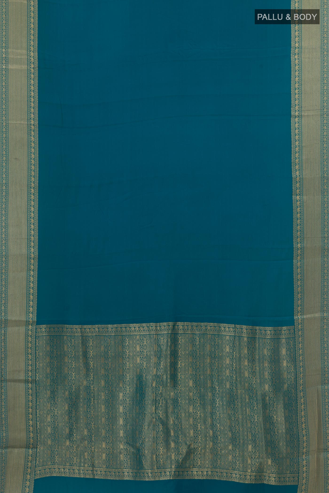 Flat view of Peacock Blue Mysore Crepe Saree with Plain Body and Zari Border. 