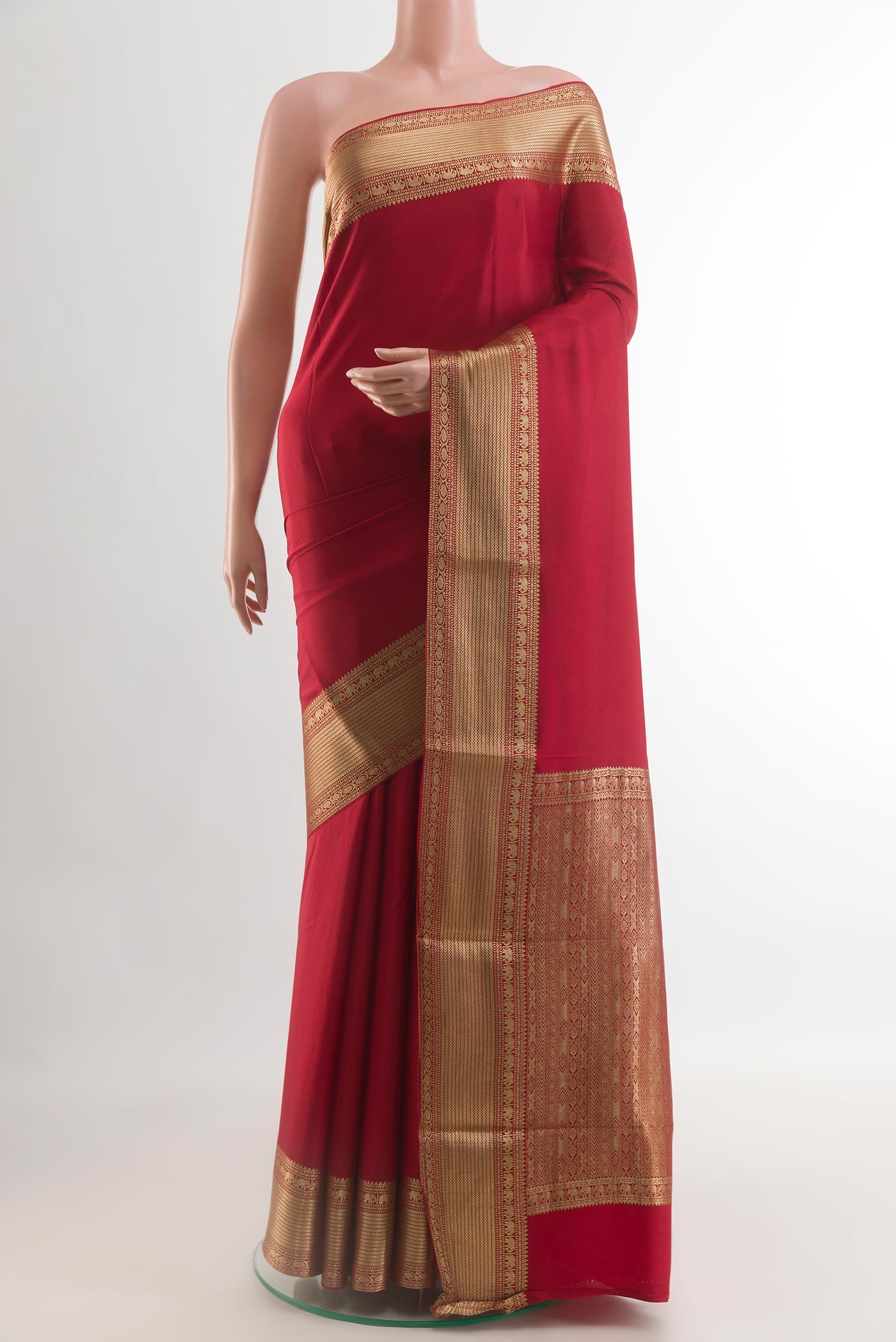 Red Mysore Crepe Saree with Plain Body and Zari Border.  displayed on a mannequin