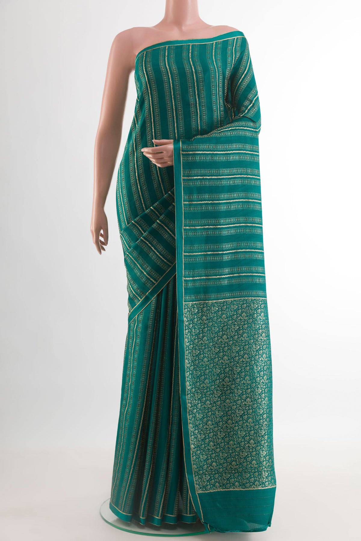 Teal Mysore Crepe Saree with Zari Brocade on the body and Zari Border.  displayed on a mannequin