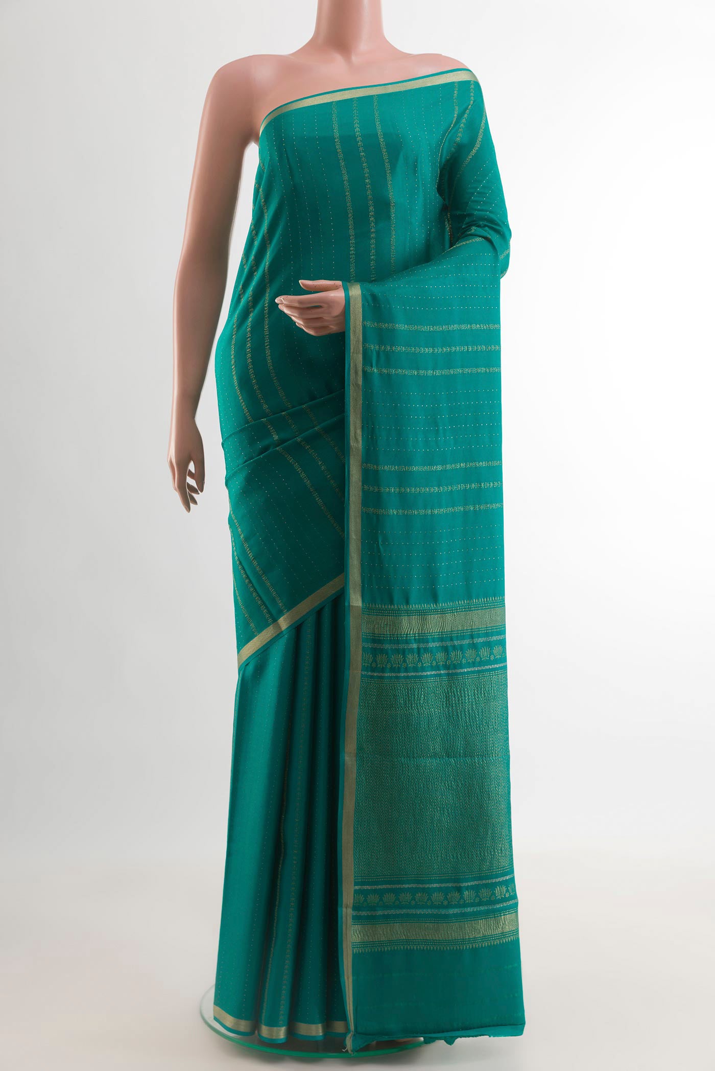 Sea Green Mysore Crepe Saree with Stripes on the body and Zari Border.  displayed on a mannequin