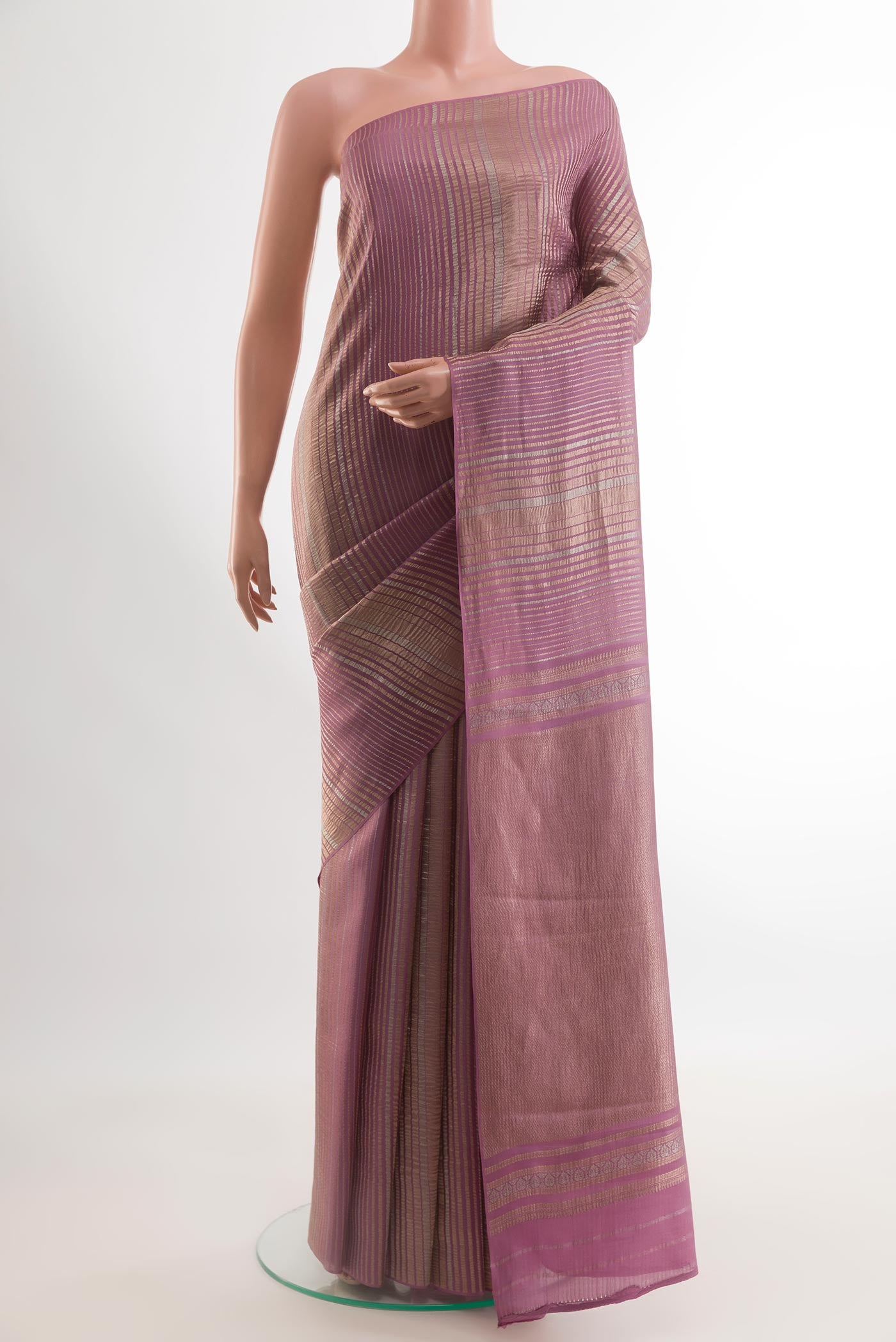 Lavender Mysore Crepe Saree with Stripes on the body and Zari Border.  displayed on a mannequin