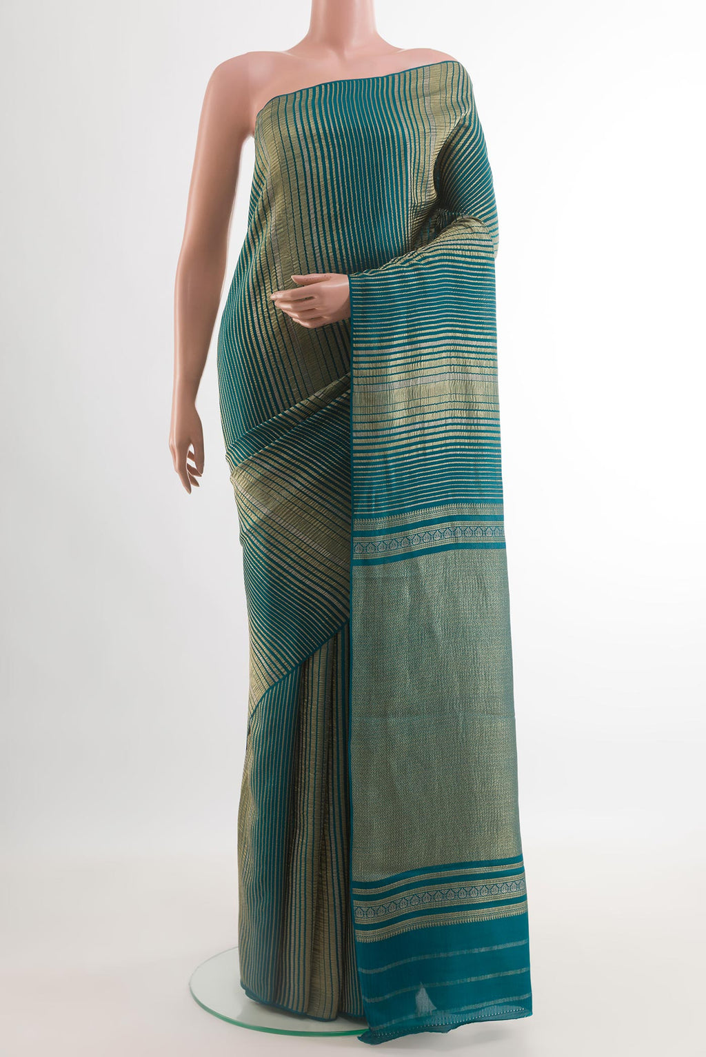 Peacock Blue Mysore Crepe Saree with Stripes on the body and Zari Border.  displayed on a mannequin