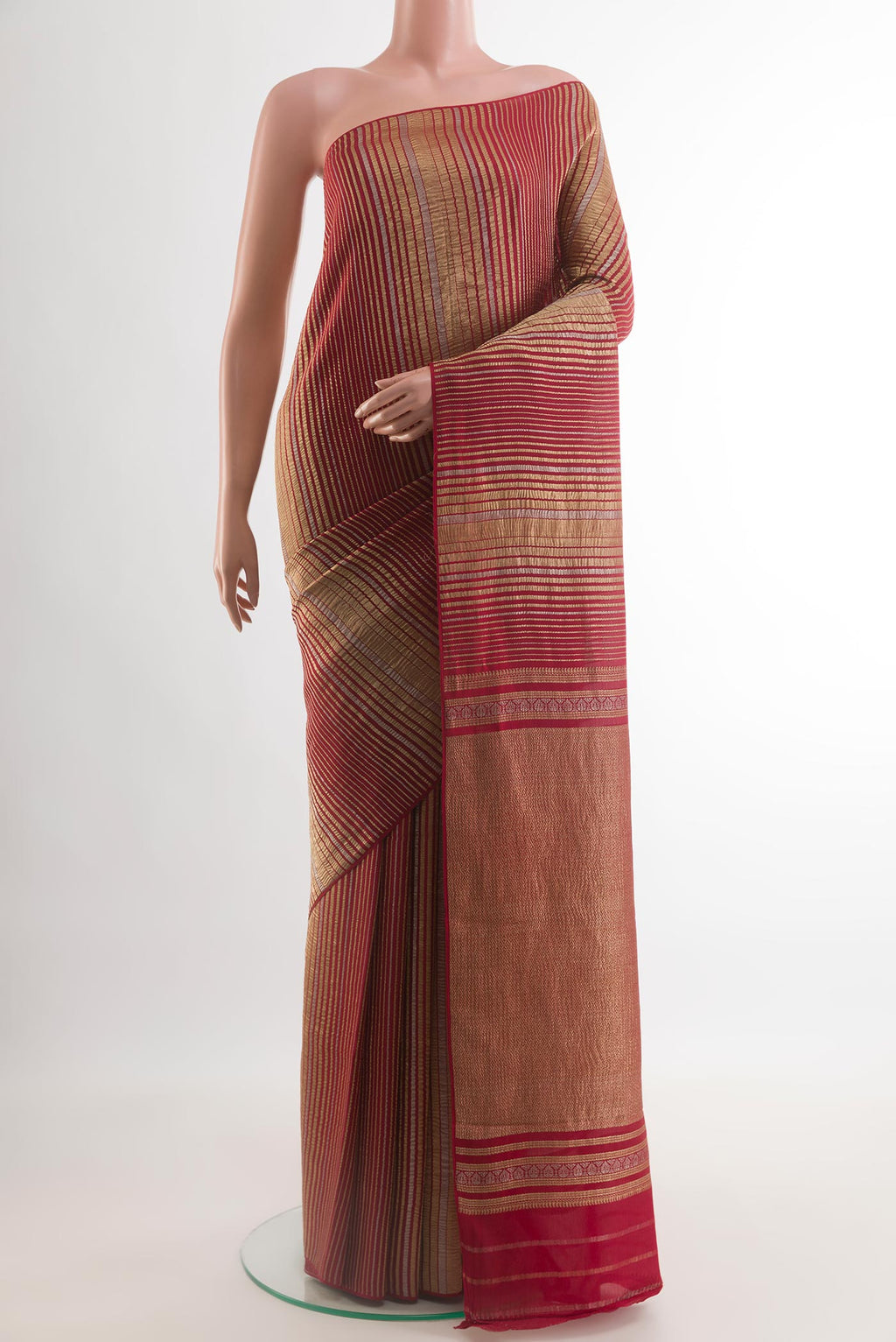 Red Mysore Crepe Saree with Stripes on the body and Zari Border.  displayed on a mannequin