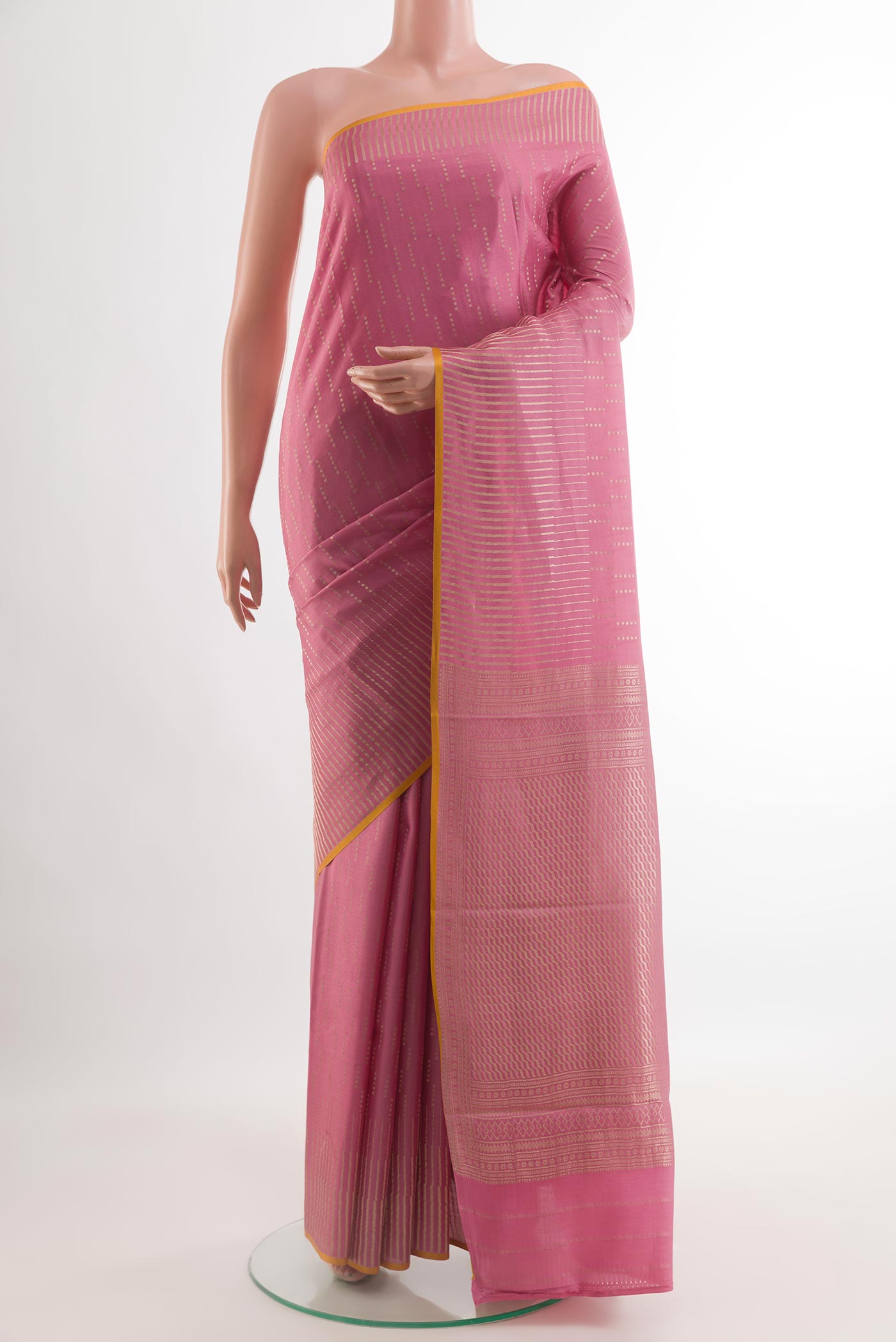 Pink Mysore Crepe Saree with Zari Brocade on the body and Zari Border.  displayed on a mannequin