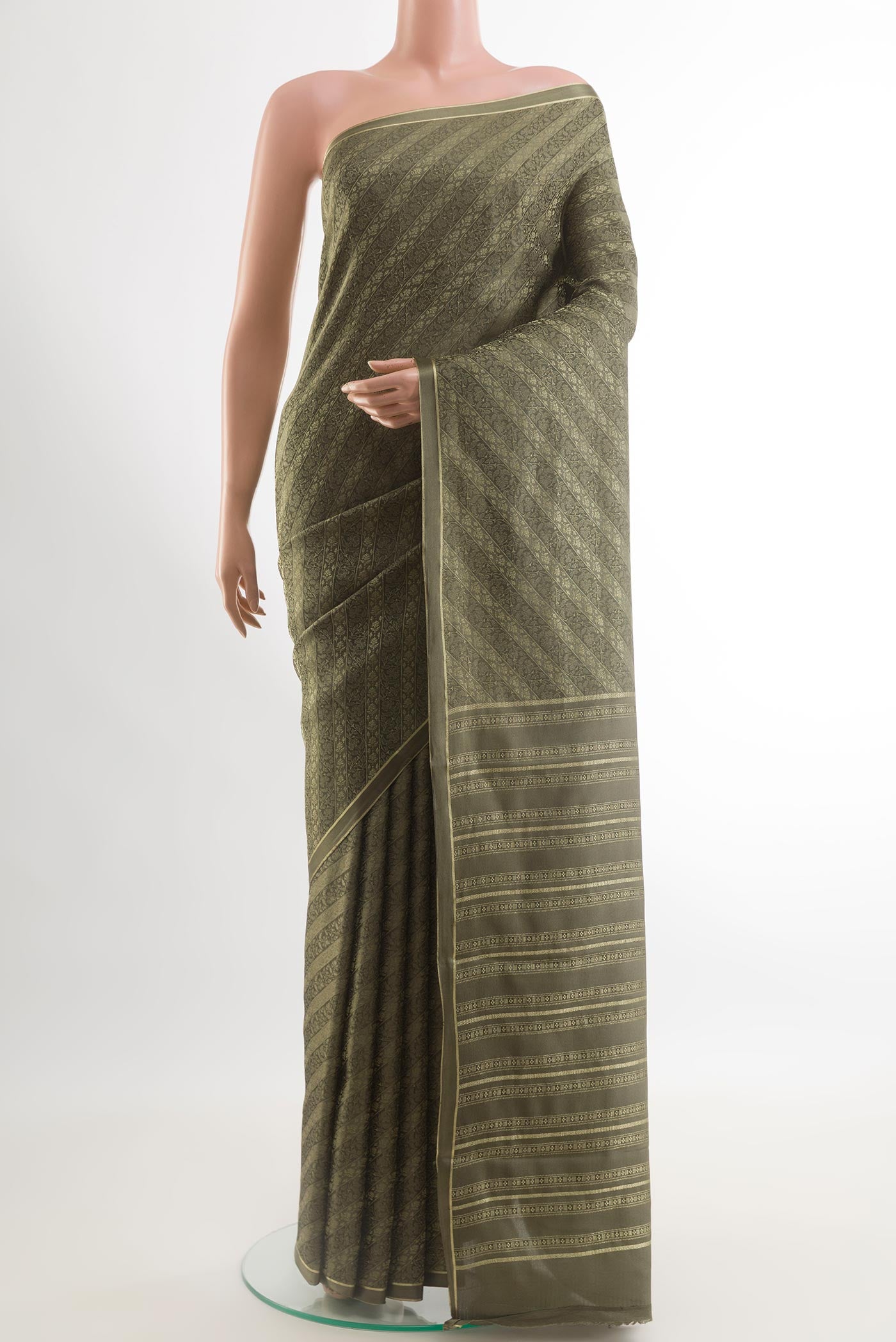 Grey Mysore Crepe Saree with Zari Brocade on the body and Zari Border.  displayed on a mannequin